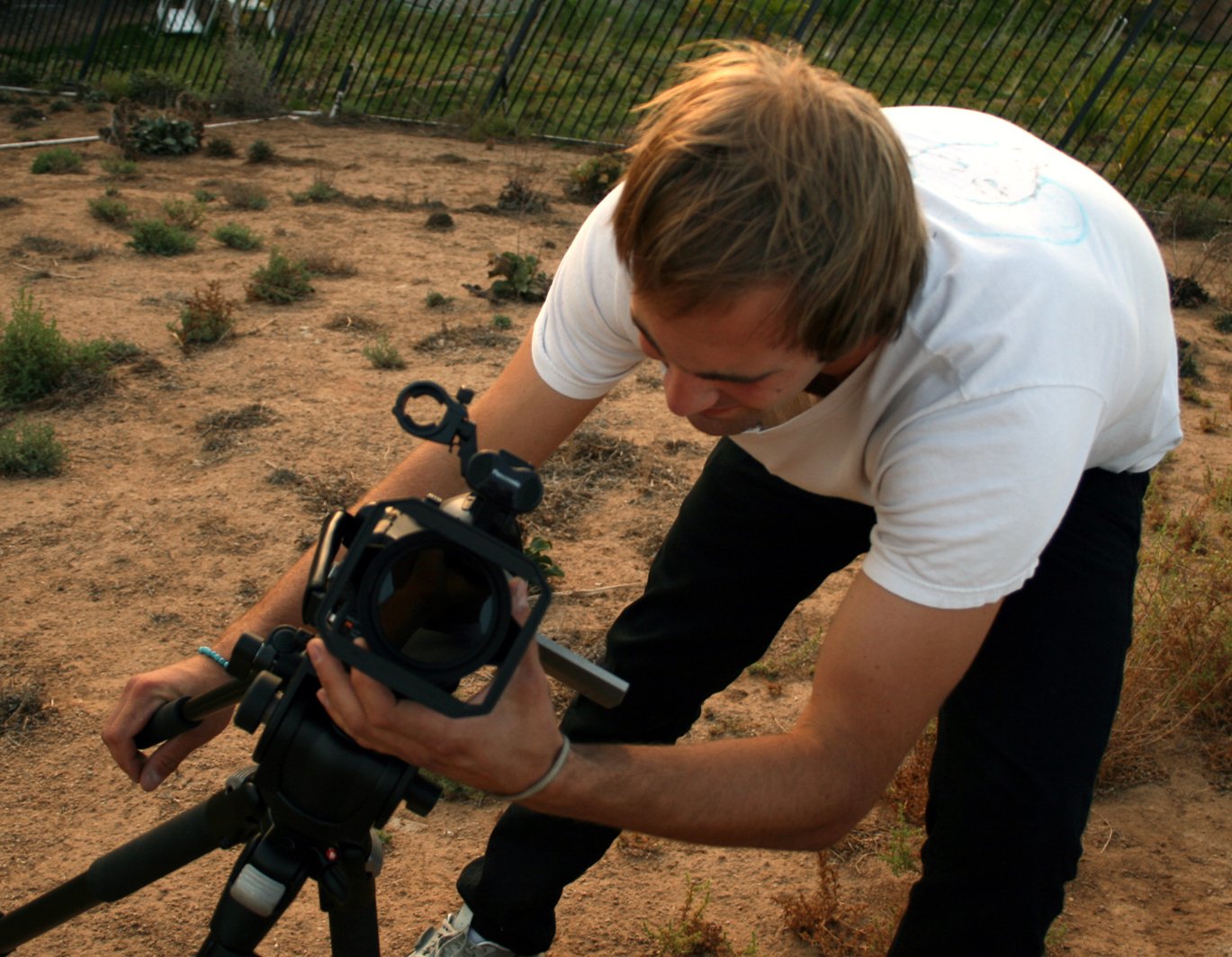 Close-up of a camera lens with a blurred control ring.